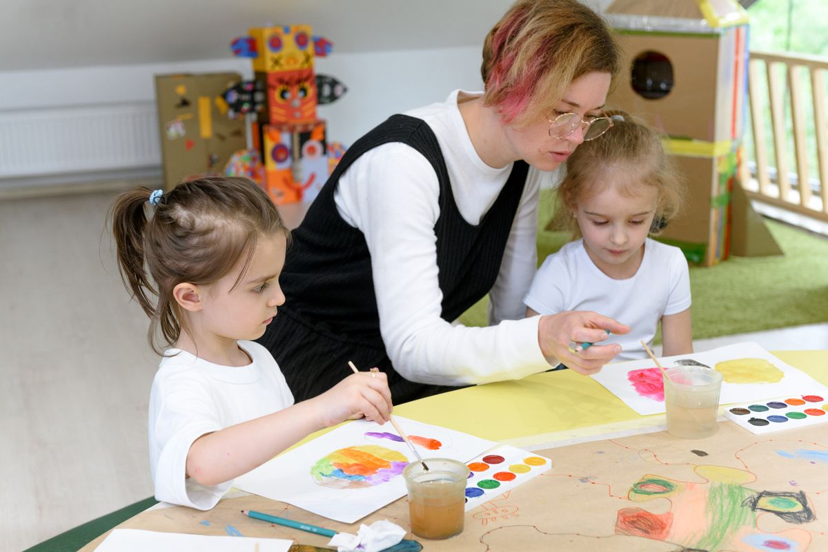 Montessori teacher with children at Magical Star Montessori Preschool